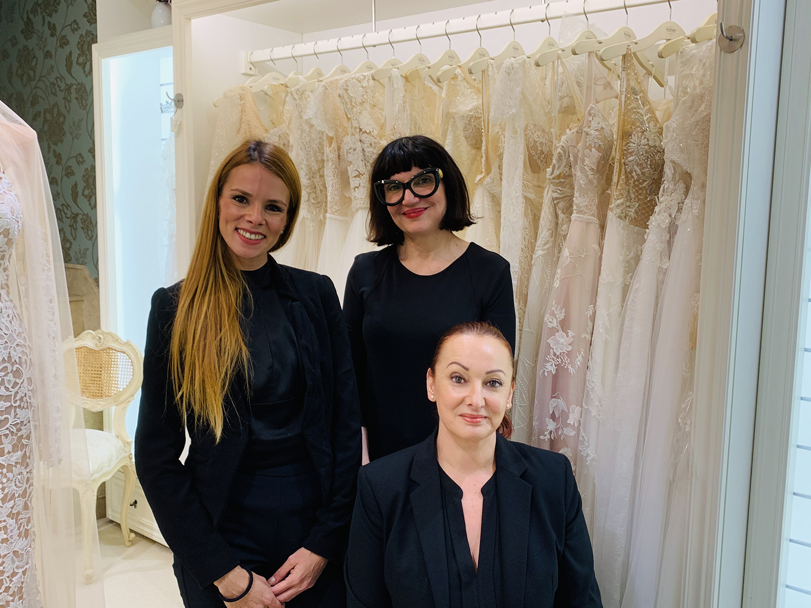 The WeddingBells team assisting a bride